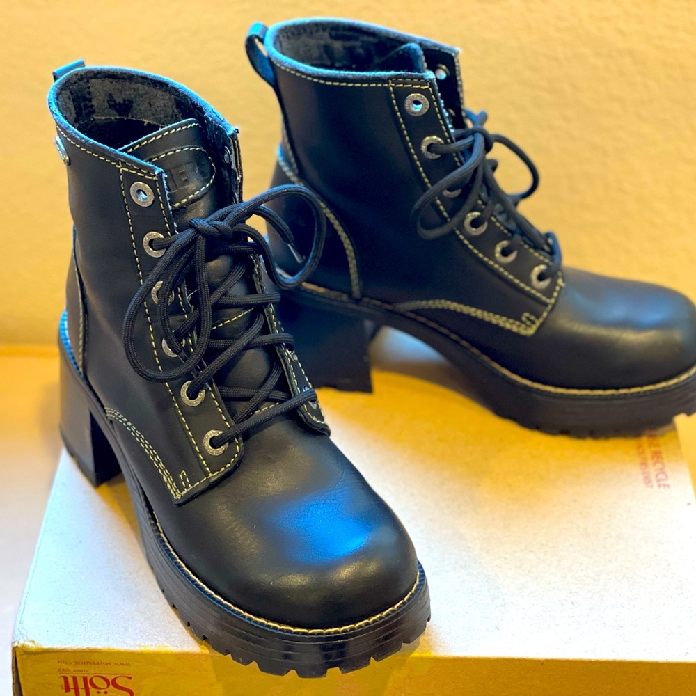 Skechers women's black boots. Leather upper balance, man-made materials.